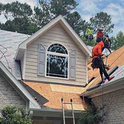 man working on a roof