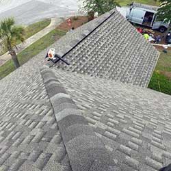 top line of gray shingles on a roof