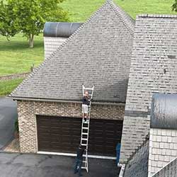 man working on a roof