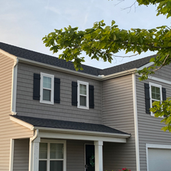 top line of gray shingles on a roof