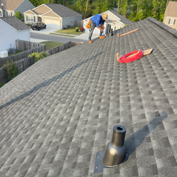 man working on a roof
