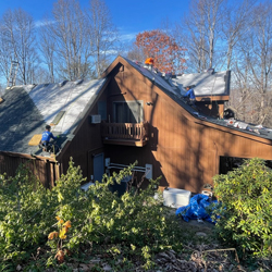 man working on a roof